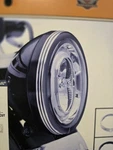 61400433 - Harley Davidson Defiance Headlight Trim, Black Machine Cut, 7". Fixed Price $190.00.
