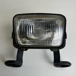 Suzuki 400SM 2010 Front Headlight With Mount Brackets. Fixed Price $271.70.