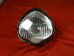 Headlight Lens Assy, 2015-26 Kawasaki Vulcan EN650, 23007-0191. Fixed Price $39.95.