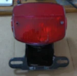 1979 Kawasaki KZ1000 Ltd K439-1) Rear Brake Tail Light Bracket 23036-1009 (073). Fixed Price $50.00.
