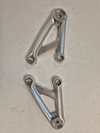 Triumph Thruxton/street Cup Oem Headlight Brackets Silver (T2706309). Fixed Price $99.00.