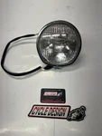 New Suzuki T250/T350/TS400 Headlight Assembly 35100-18610. Fixed Price $499.95.