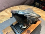 Motorcycle Black Headlight Assembly (side Mount) Top, Sae 76 001-09. Fixed Price $15.00.