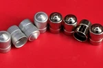Schrader Vintage Auto Tire Valve Stem Caps Aluminum & Nickel 2 Sets. Fixed Price $29.99.
