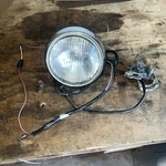 1979 Kawasaki KV75 Headlight Assembly 23004-023 #1238. Fixed Price $125.00.