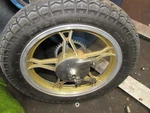 1990 Suzuki GN125 Rear Wheel Rim With Tire. Fixed Price $150.00.