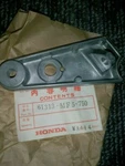 1985-1986 Honda VT500 Stay L. Head Light #61313-MF5-750 New Old Stock. Fixed Price $50.00.