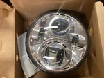 New Daymaker Headlamp Chrome Softail. Pn 73391-10A. Fixed Price $371.21.