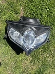 2008-2009 Suzuki 750 GSXR600 Gixxer Front Lens. Fixed Price $194.24.