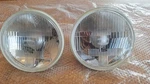 New Pair Made In Japan! Koito 7" Round Glass Headlight Halogen H4 With Bulbs. Fixed Price $53.95.