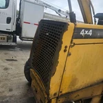 John Deere 310E Grille - Used P/n T160691. Fixed Price $659.99.