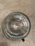 Suzuki 35121-18610 Nos Headlight T350 TS400. Fixed Price $350.00.