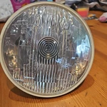 Carello 3/4 Headlight 07.245.800. 07.235.700 Nos. New Old Stock. Fixed Price $99.95.