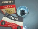 Lucas Nos Headlamp Bulb Adaptor X Dual Contact #554602 157-000. Fixed Price $45.00.